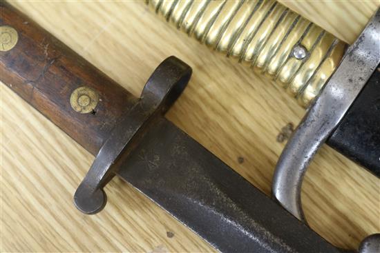 Three late 19th century French bayonets, a US Army bayonet, an EFD 1892 bayonet and an epee